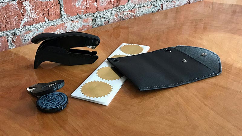embossing seal and synthetic leather pouch